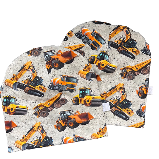 Maskiner på betong Lue