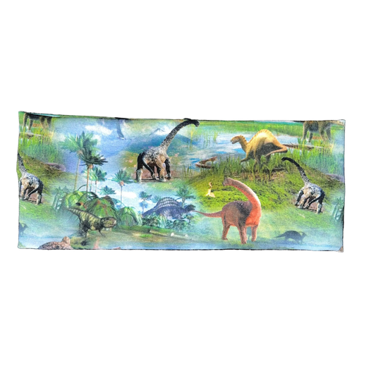Pannebånd med dinosaurer i blå og grønn